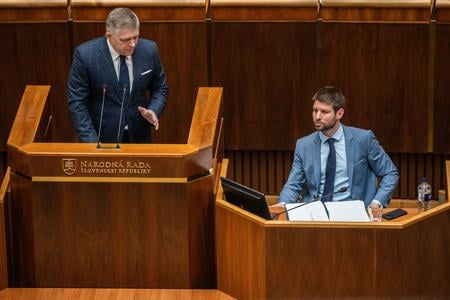 PM Robert Fico (Smer, left) and MP Michal Šimečka (Progressive Slovakia).