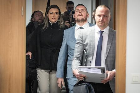 Daniel Bombic (the second) enters the courtroom on February 6, 2025. Ahead of him walks his defence lawyer, David Lindtner. Behind Bombic is MEP Judita Laššáková.
