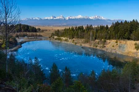 A view of the High Tatras from above the flooded quarry in Poprad's borough of Kvetnica.