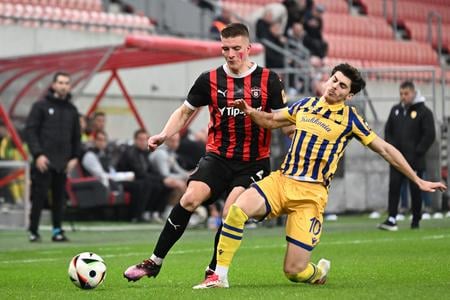 In the photo, from left, Libor Holík (Trnava) and Ammar Ramadan (DAC) battle for the ball during the first-round match of the championship group in the Niké Liga between FC Spartak Trnava and FC DAC Dunajská Streda in Trnava on Saturday, March 8, 2025.