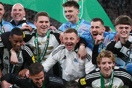 Martin Dúbravka (top right) celebrates winning the trophy with his teammates.