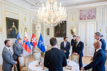 President Peter Pellegrini hosted a roundtable on defence spending with leaders of parliamentary parties. Pictured on 17 June 2025 in Bratislava, awaiting the president’s arrival (left to right): Interior Minister Matúš Šutaj Eštok (Hlas), Prime Minister Robert Fico (Smer, second from left), Michal Šimečka (Progressive Slovakia, centre foreground), Branislav Gröhling (SaS, right foreground), Milan Majerský (KDH, far right), Andrej Danko (SNS, back right), and Defence Minister Robert Kaliňák (Smer, back centre).