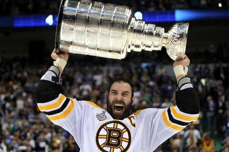 Boston Bruins' Zdeno Chára hoists the Stanley Cup following the Bruins' 4-0 win over the Vancouver Canucks in Game 7 of the NHL Finals on June 15, 2011.