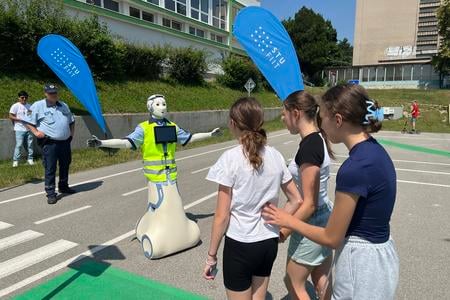 A humanoid robot helping children cross the road in Bratislava.