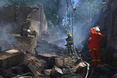 Emergency services personnel work to extinguish a fire following a Russian attack in Odesa, Ukraine, Friday, 11 July 2025.