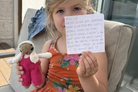 The happy recipient of a newly discovered knitted rabbit.