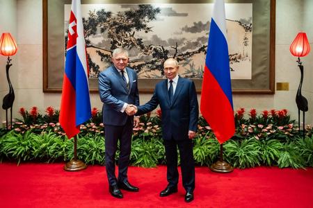 Prime Minister Robert Fico of Slovakia and President Vladimir Putin of Russia shaking hands in Beijing on Sept. 2, 2025.