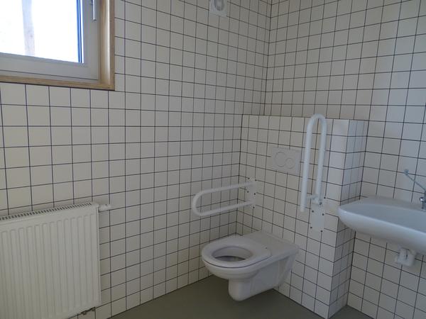 The toilet on the upper floor.