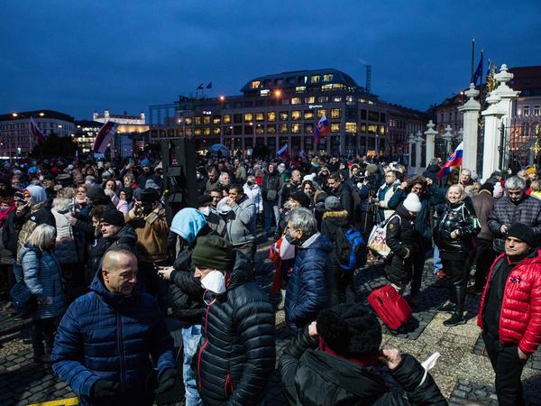 The crowd gathered in front of the Presidential Palace, many of participants not wearing masks.