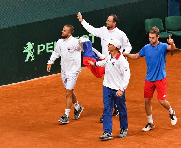 Slovak team (L-R Andrej Martin, Igor Zelenay, Jozef Kovalík and Norbert Gombos) celebrate after the winning match against Poland in Davis Cup.  