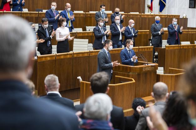 Applause after passing programme statement.