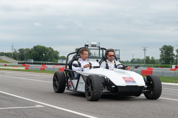 Transport Minister Andrej Doležal (l) during a test ride of the autonomous vehicle developed by STU and technology companies.