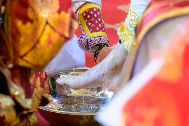 Metropolitan Jonáš Maxim washes a priest’s foot during the Maundy Thursday foot-washing ceremony at the Cathedral of St John the Baptist in Prešov on 17 April 2025.