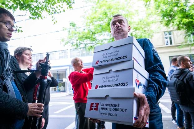 Members of the Slovenské Hnutie Obrody party submitting the petition to the Presidental Office on Monday, May 5.