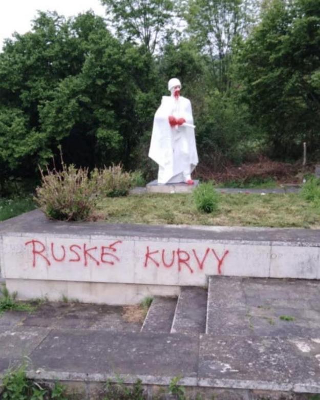 The defaced memorial, sprayed with the inscription “Russian whores”.