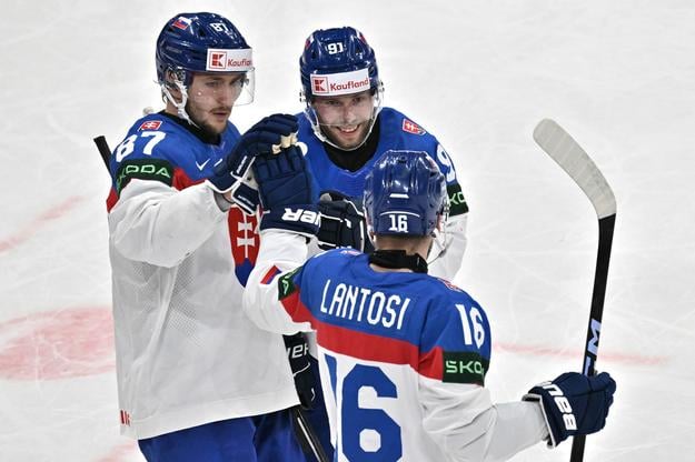 Slovakia’s Pavol Regenda and captain Matúš Sukeľ celebrate Róbert Lantoši’s goal during their Group A match against Finland at the 88th Ice Hockey World Championship in Stockholm on 20 May 2025.