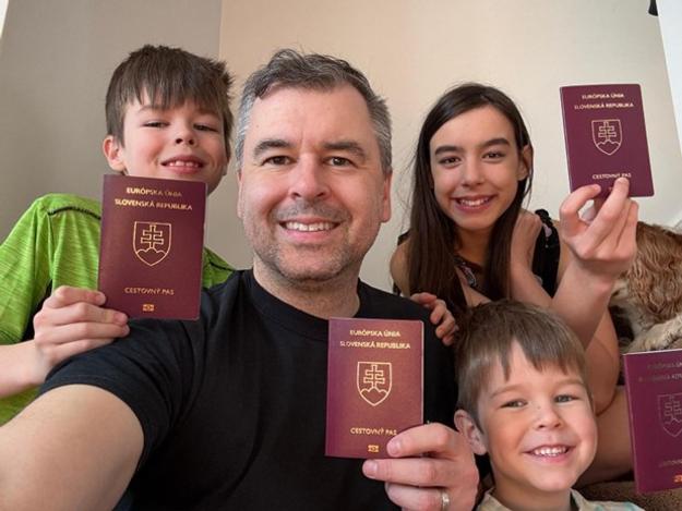 Jonathan Lukca with his three children, proudly holding their Slovak passports after reclaiming citizenship.
