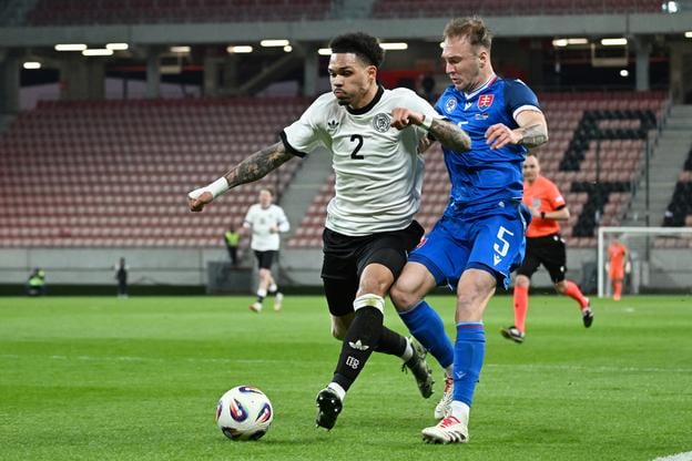 Dominik Javorček a hráč Nemecka Nnamdi Collins počas prípravného zápasu.