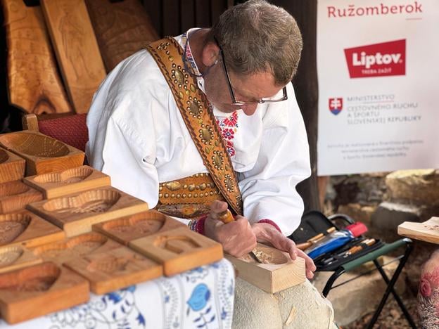 Traditional wood carving in Vlkolínec.