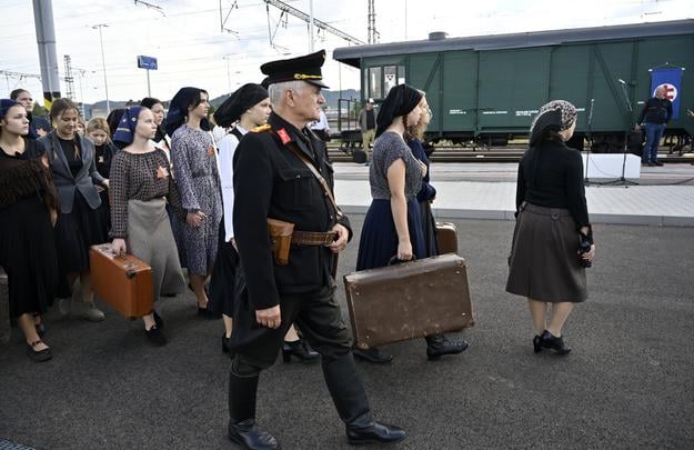On 9 September 2025 in Humenné, female students in period dress staged a historical procession — retracing the deportation route from the museum to the railway station, ending at a vintage wagon.