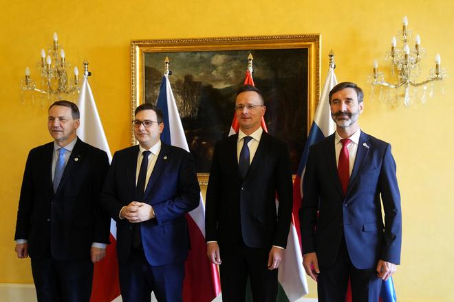 Czech Republic's Foreign Minister Jan Lipavský, second left, welcomes his counterparts from Poland Radoslaw Sikorski, left, from Slovakia Juraj Blanár, right, and Hungary Péter Szijjártó, second right, as they meet in Prague, Czech Republic, on March 21, 2024.