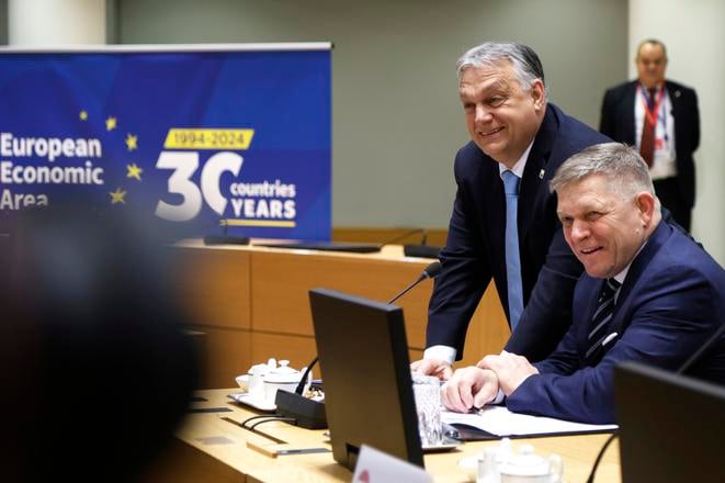 Slovakia's Prime Minister Robert Fico, right, and Hungary's Prime Minister Viktor Orbán pose for photographers during a round table meeting at an EU Summit in Brussels on March 22, 2024.