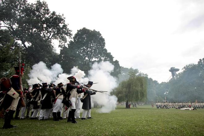 The "soldiers" fired antique rifles, wowing spectators and scaring some children.
