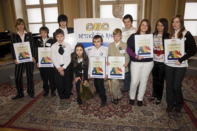 Children who received a Noble Deed award pose after the ceremony.