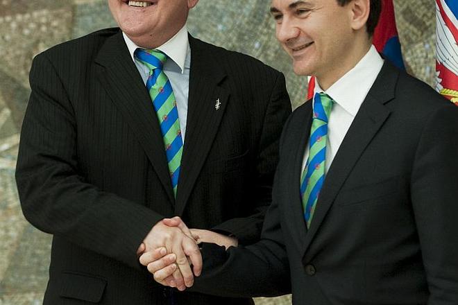 Serbian deputy premier Božidar Djelič passed the Decade presidency on to Dušan Čaplovič (left) in Belgrade
