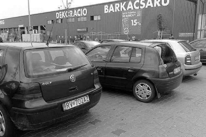 Slovak-registered cars parked at a store in Hungary