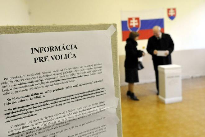 President Ivan Gašparovič and his wife Silvia vote.