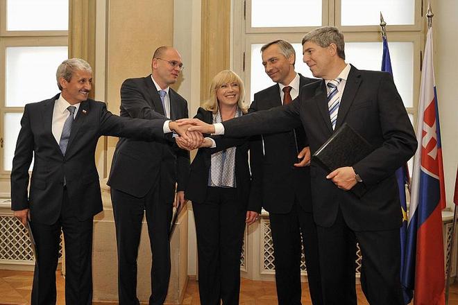 Coalition partners share a united gesture as their election term begins.