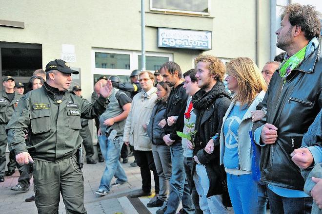 Several activists formed a humanchain to block anti–Roma marchers in Bratislava.