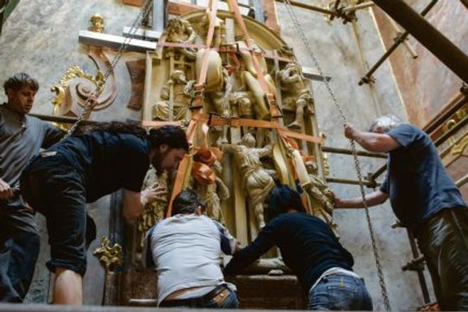 Experts moving a stone altar in Nitra that covered a unique 14th century fresco.