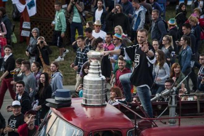Hockey player Marián Gáborík riding around the festival with the Stanley Cup. 