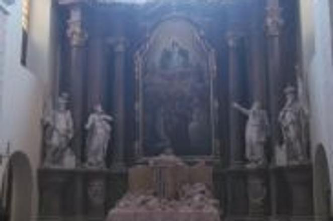 The collapsed tower partially demolished the church.