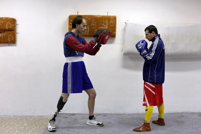 Koza (R) prepares for a match.
