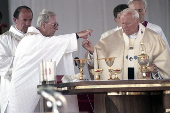 Korec (2L) aids Pope John Paul II during a holy mass in the Slovak town of Levoča. 