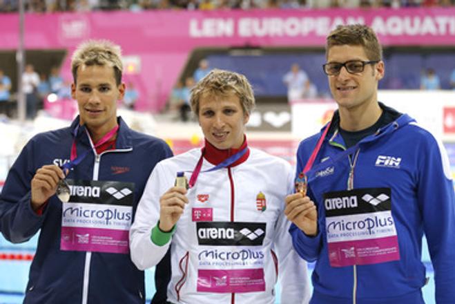 Winner David Verraszto of Hungary (C), Richard Nagy of Slovakia, placed second, (L) and Federico Turrini of Italy, placed third, pose with their medals after the men's 400m medley final at the European Aquatics Swimming Championships in London.