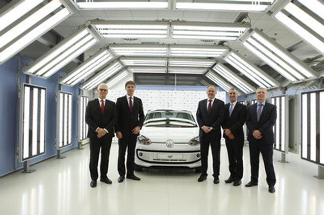 Chair of VW Slovakia board Reimold (2R) with (L-R) VW SK board member Eric Reuting, Bratislava Mayor Ivo Nesrovnal, Slovak President Andrej Kiska, and VW SK board member Jens Kellerbach in the Bratislava plant. 