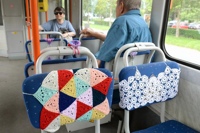 Tram with colourful crochet rugs