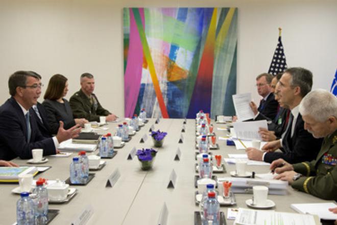 US Secretary of Defense Ash Carter (L), speaks with NATO Secretary General Jens Stoltenberg (2R) during a meeting at NATO headquarters in Brussels on February 10