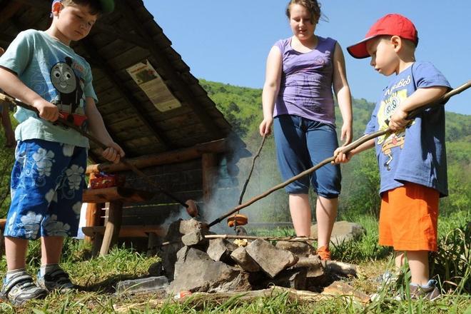Ready to roast a Slovak “špekáčik” using the traditional wooden stick. 