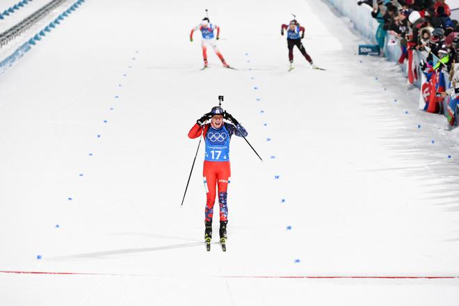 Ivona Fialková of Slovakia crosses the finish line.