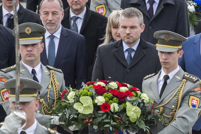PM Peter Pellegrini (C) laying wreaths at the Slavín WWII memorial in Bratislava.