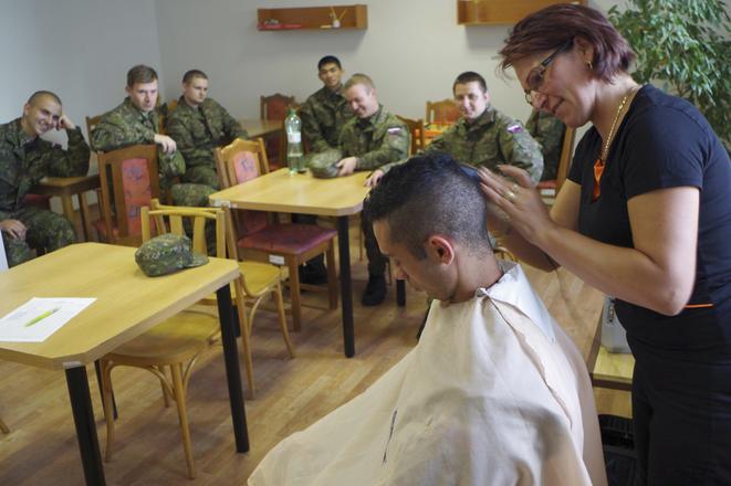 Cutting of hairs prior to starting voluntary military training. 