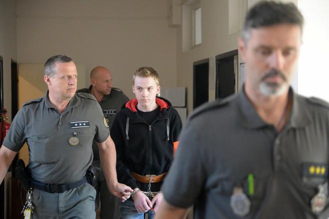 The driver of the car fleeing police, in which an innocent youth was shot down, leaves court on June 27, 2018.