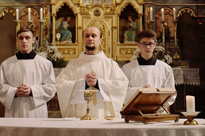 Actor Daniel Fischer portrays a Catholic priest in Škop's film Nech je svetlo (Let There Be Light).