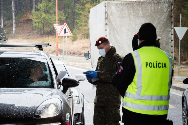 Police officers and soldiers jointly check vehicles on the Slovak-Czech border crossing of Makov/Bíla-Bumbálka on March 11, 2020.