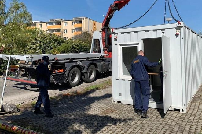 Police brought a container to serve as interrogation room near the retirement home in Pezinok. 